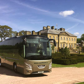 Coast to Coast Travel coach parked at the gardens at Dumfries House