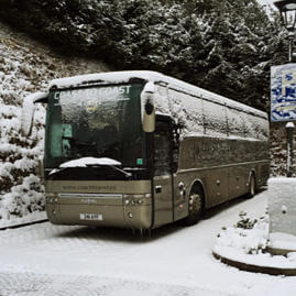Coast to Coast Travel coach with a light covering of snow